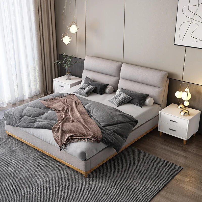 Cream leather queen bed with solid wood frame, modern and elegant.