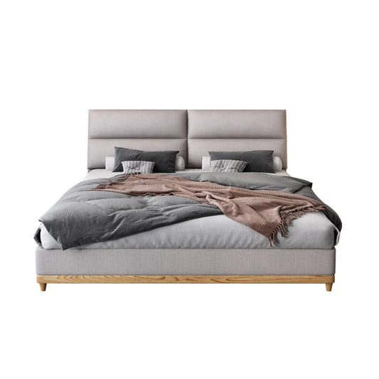 Cream leather queen bed with solid wood frame, modern and elegant.