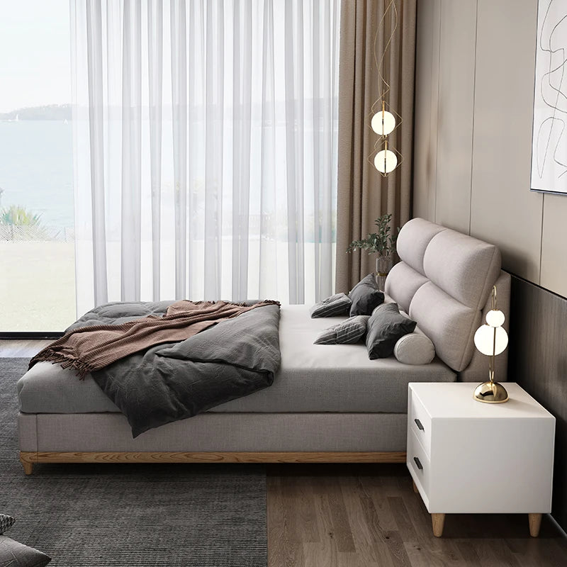 Cream leather queen bed with solid wood frame, modern and elegant.