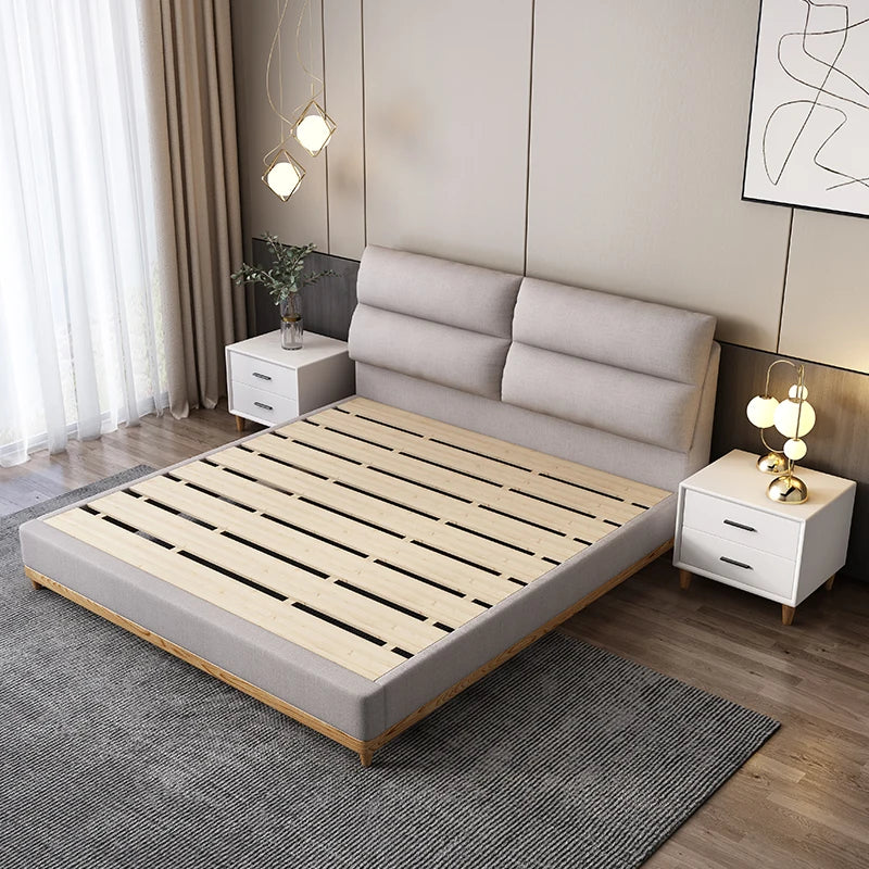 Cream leather queen bed with solid wood frame, modern and elegant.