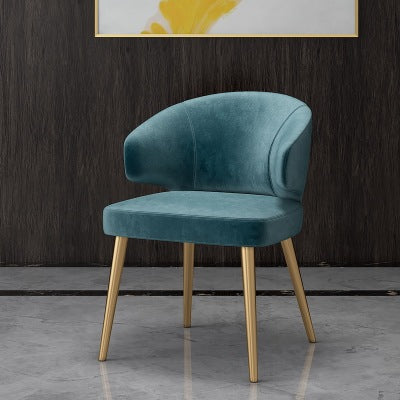 Colorful velvet dining chair with blue seat and black metal legs.