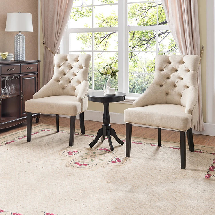 Luxury velvet dining chair with solid wood frame and tufted button design.