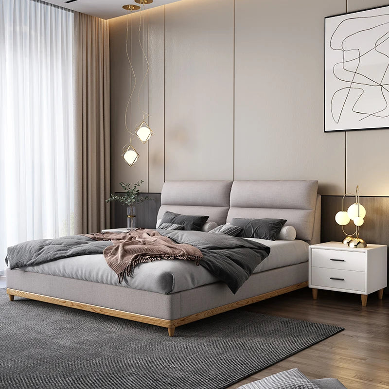 Cream leather queen bed with solid wood frame, modern and elegant.