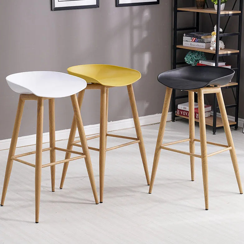 Industrial dining chair with plastic honeycomb top & wood-grain steel legs.